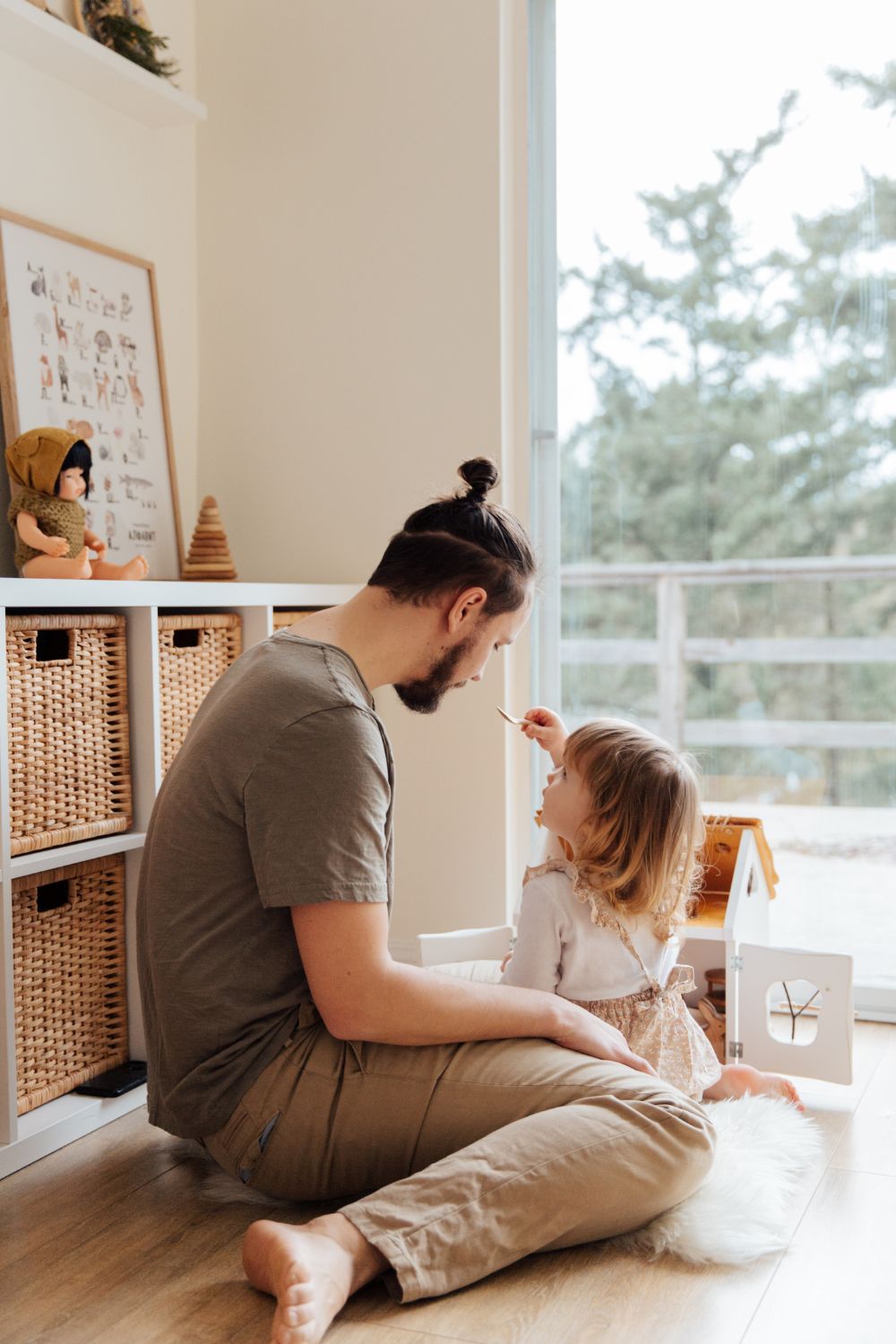 child and father playing together.