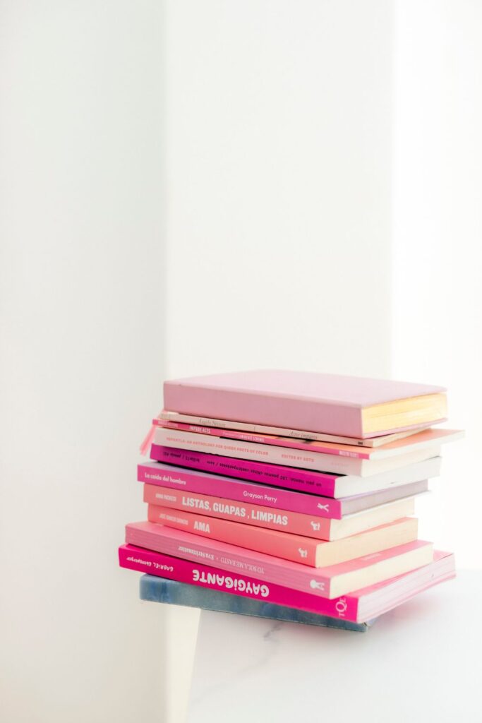 stack of pink themed books